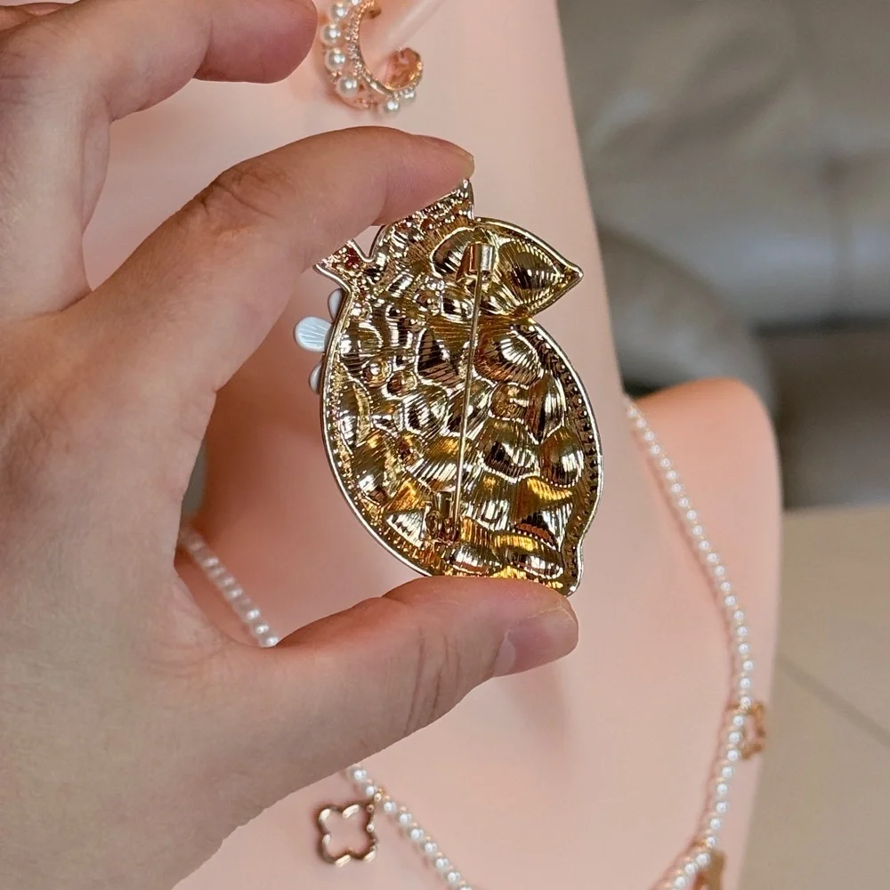 Elegant Gold and Green Crystal Brooch